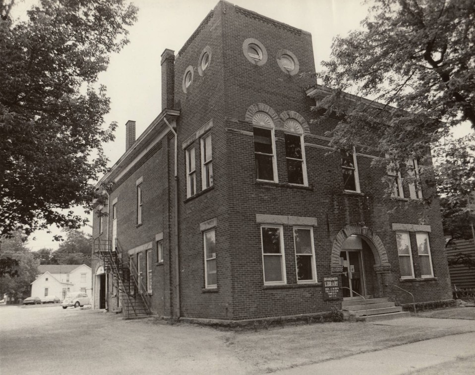 A brick library with circular windows.