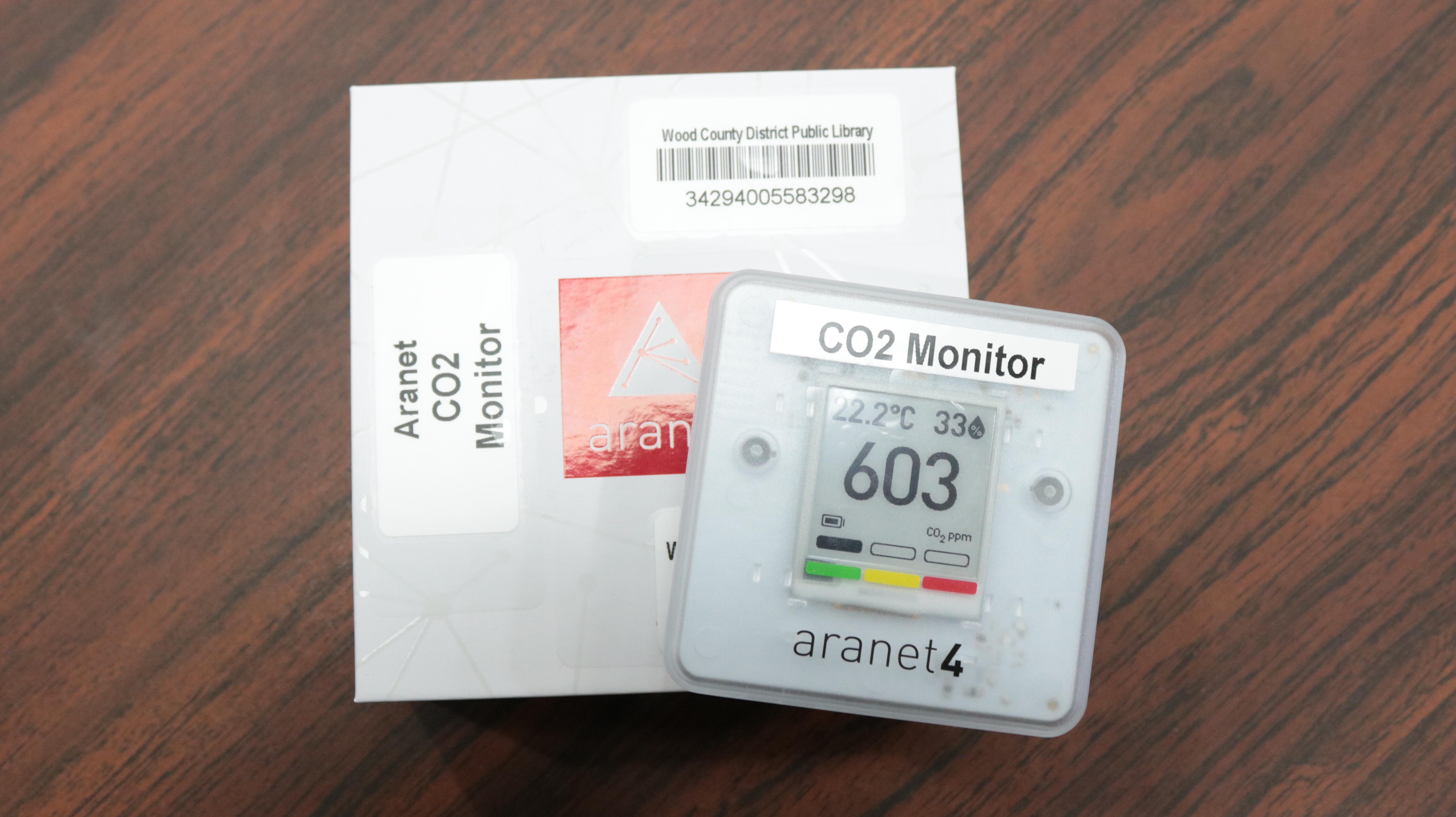 A white CO2 detector on a table.